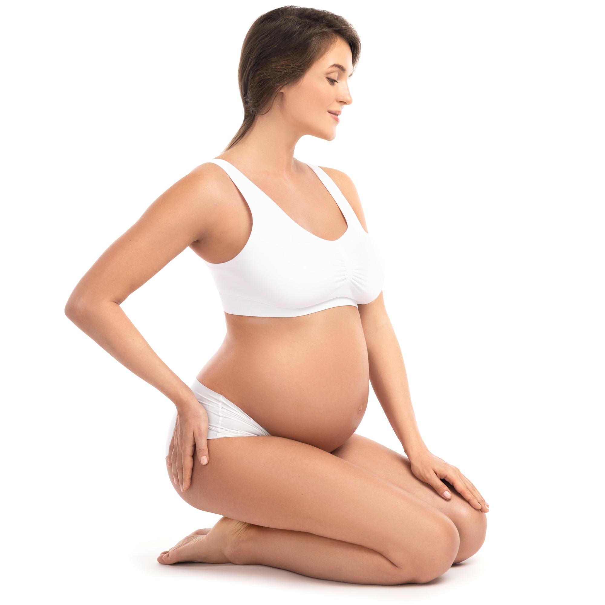Young and pregnant woman on white background